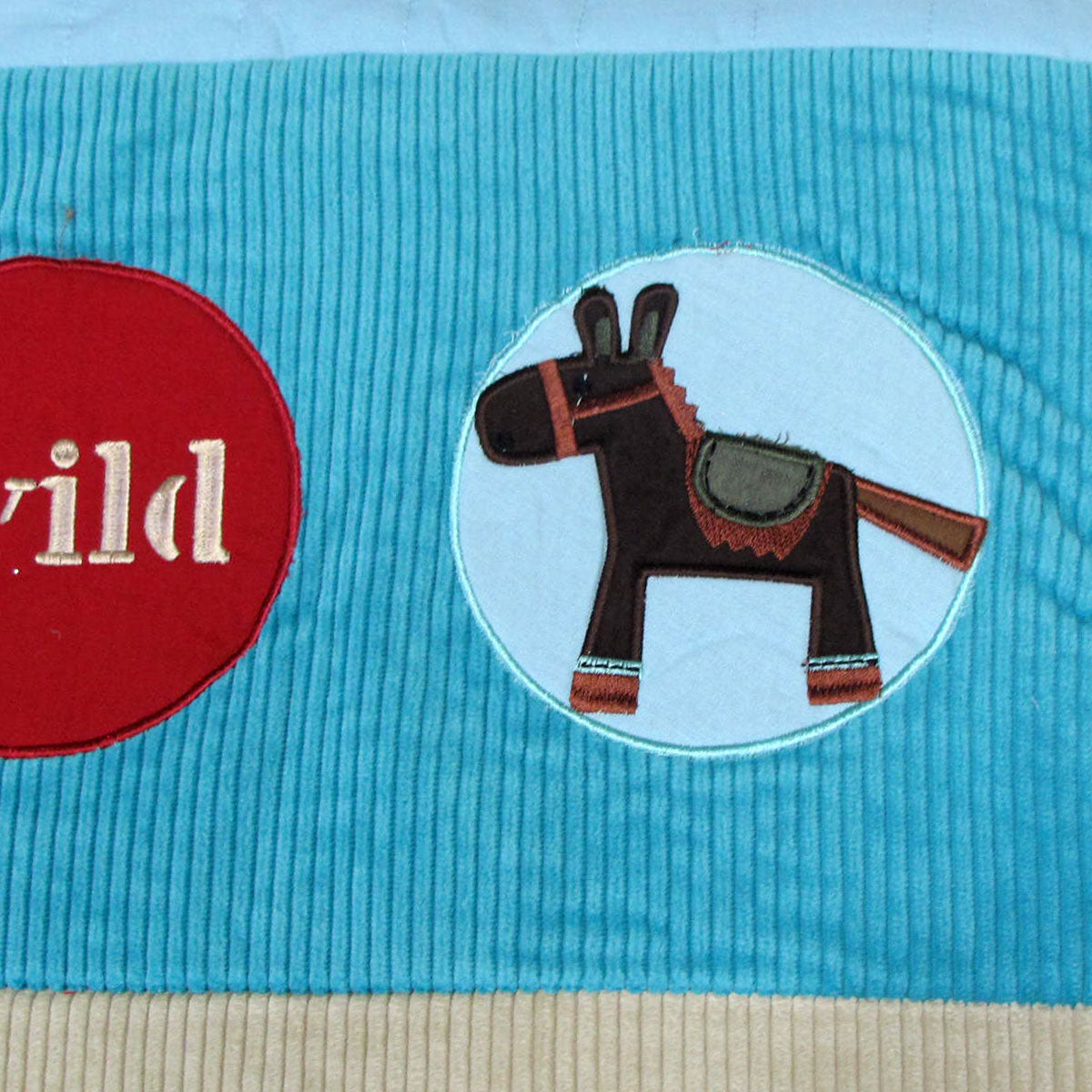 Happy Kids Wild Wild West Blue Embroidered Comforter featuring horse and cowboy hat designs, with a bonus cushion, perfect for children's bedrooms.