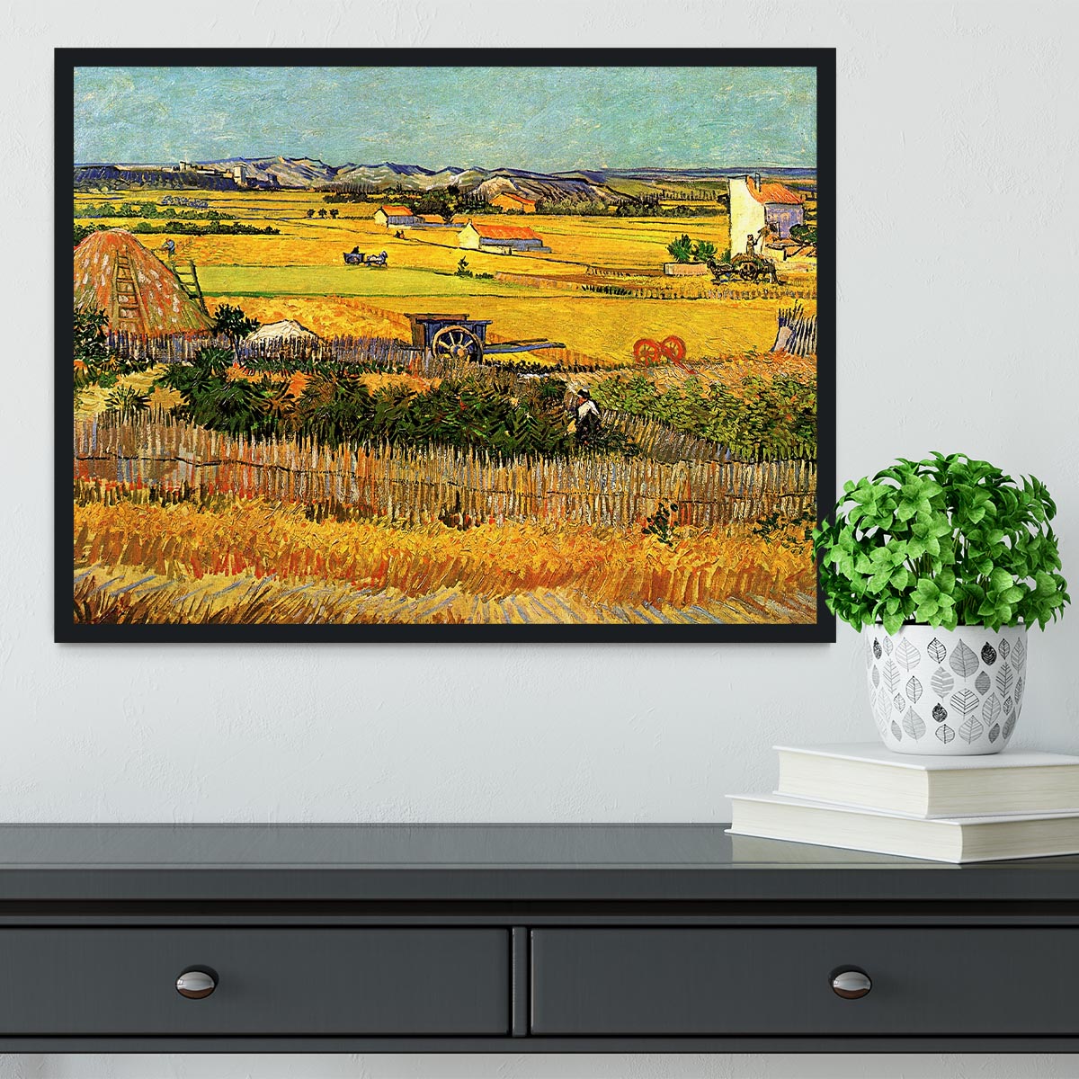 A beautifully framed reproduction of Van Gogh's 'Harvest at La Crau with Montmajour in the Background', showcasing vibrant colors and intricate details.
