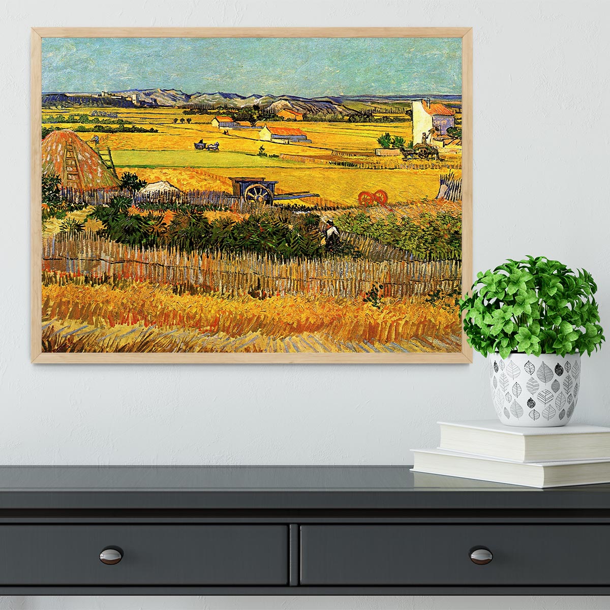 A beautifully framed reproduction of Van Gogh's 'Harvest at La Crau with Montmajour in the Background', showcasing vibrant colors and intricate details.