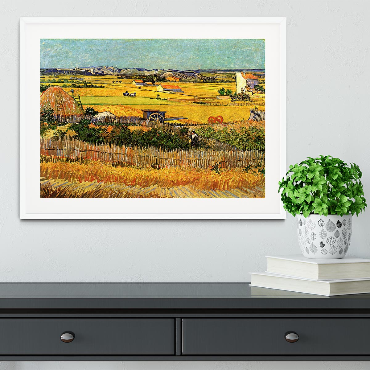 A beautifully framed reproduction of Van Gogh's 'Harvest at La Crau with Montmajour in the Background', showcasing vibrant colors and intricate details.