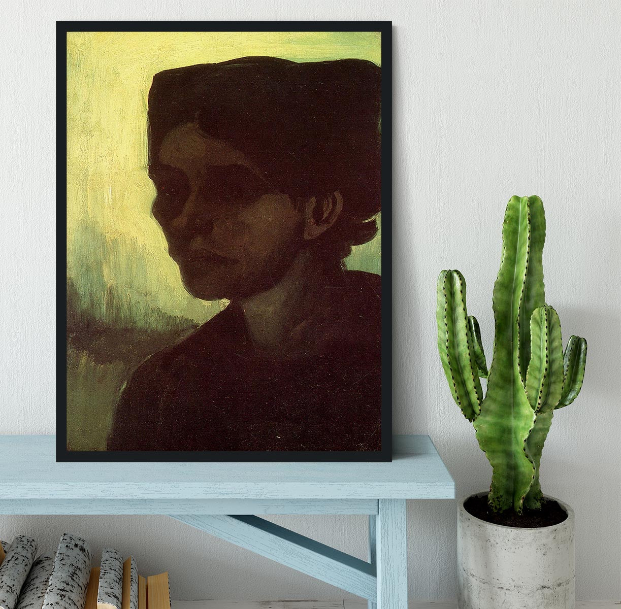 Framed print of Van Gogh's 'Head of a Young Peasant Woman with Dark Cap', showcasing vibrant colors and intricate details.