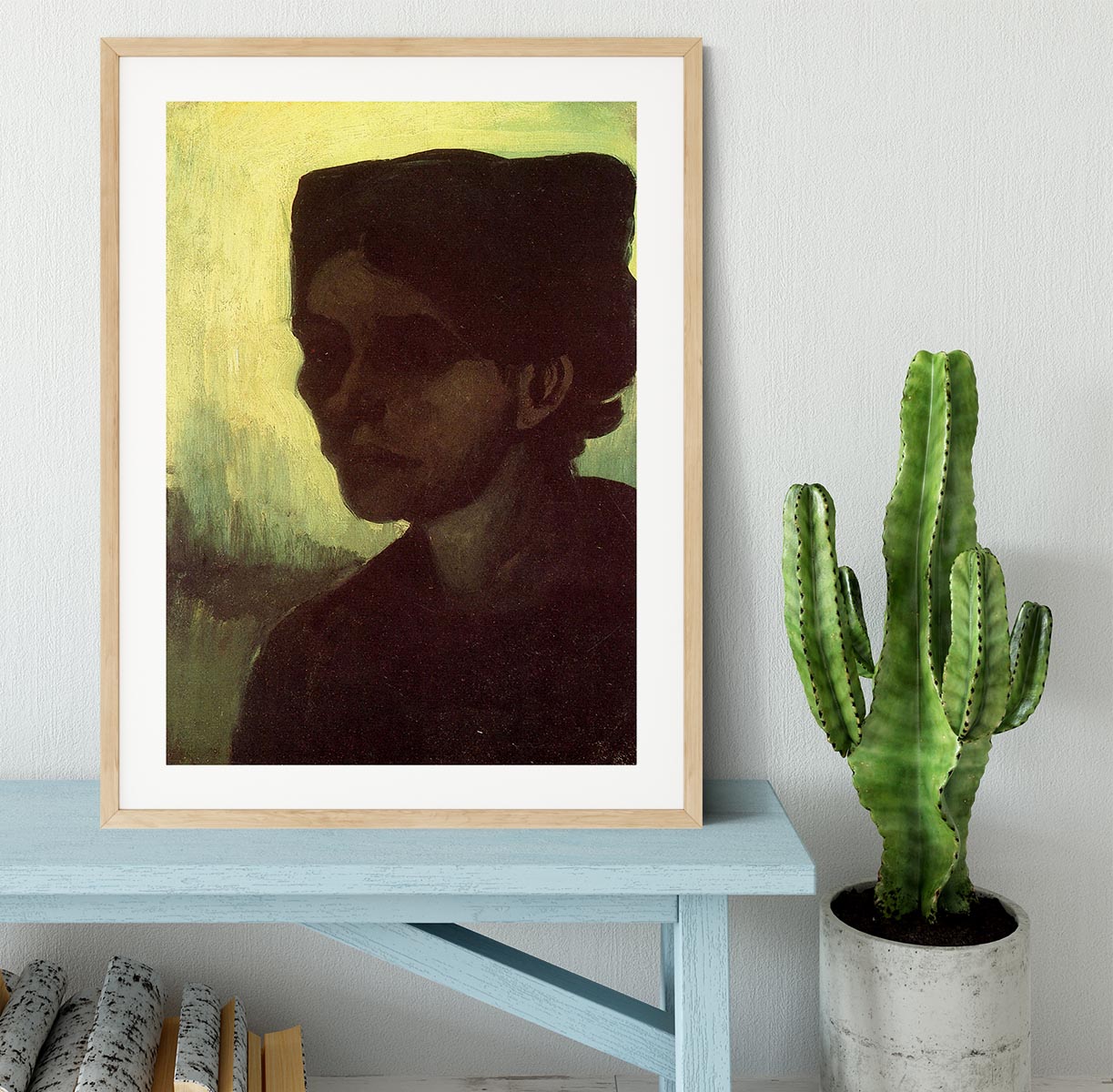 Framed print of Van Gogh's 'Head of a Young Peasant Woman with Dark Cap', showcasing vibrant colors and intricate details.