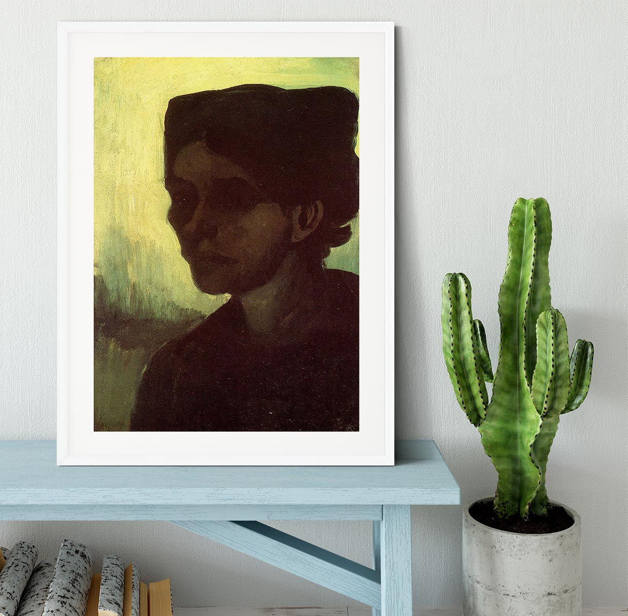 Framed print of Van Gogh's 'Head of a Young Peasant Woman with Dark Cap', showcasing vibrant colors and intricate details.
