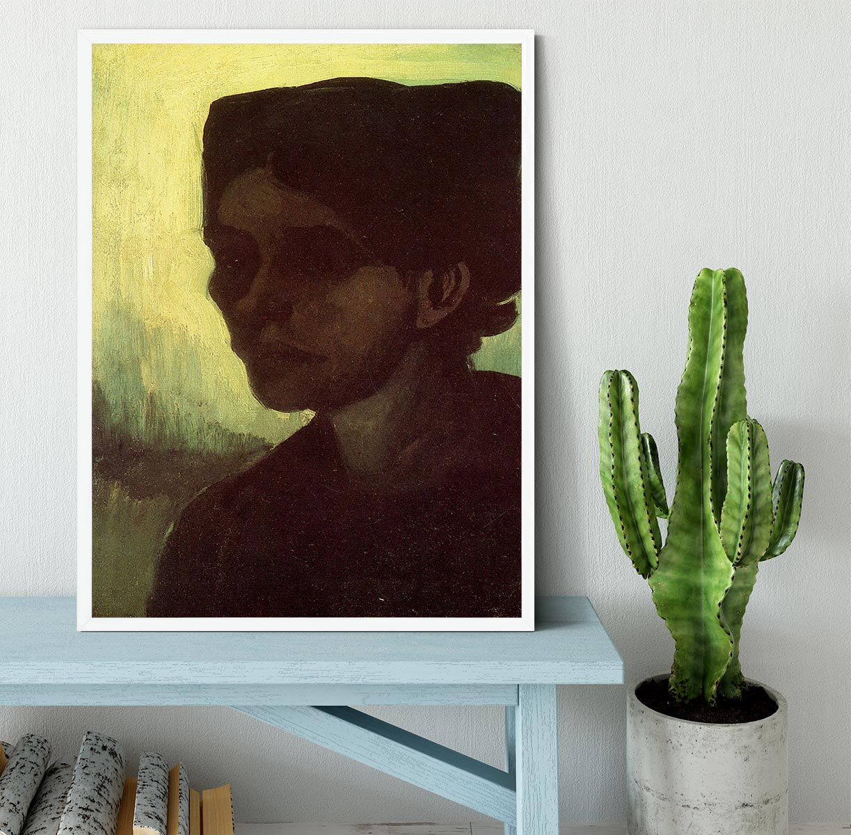 Framed print of Van Gogh's 'Head of a Young Peasant Woman with Dark Cap', showcasing vibrant colors and intricate details.
