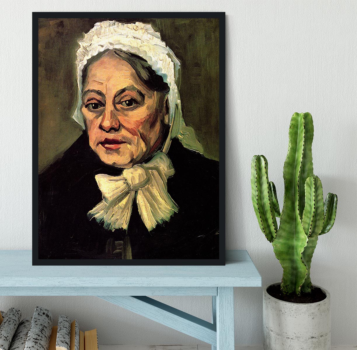 Framed artwork of Van Gogh's 'Head of an Old Woman with White Cap', showcasing intricate details and vibrant colors.