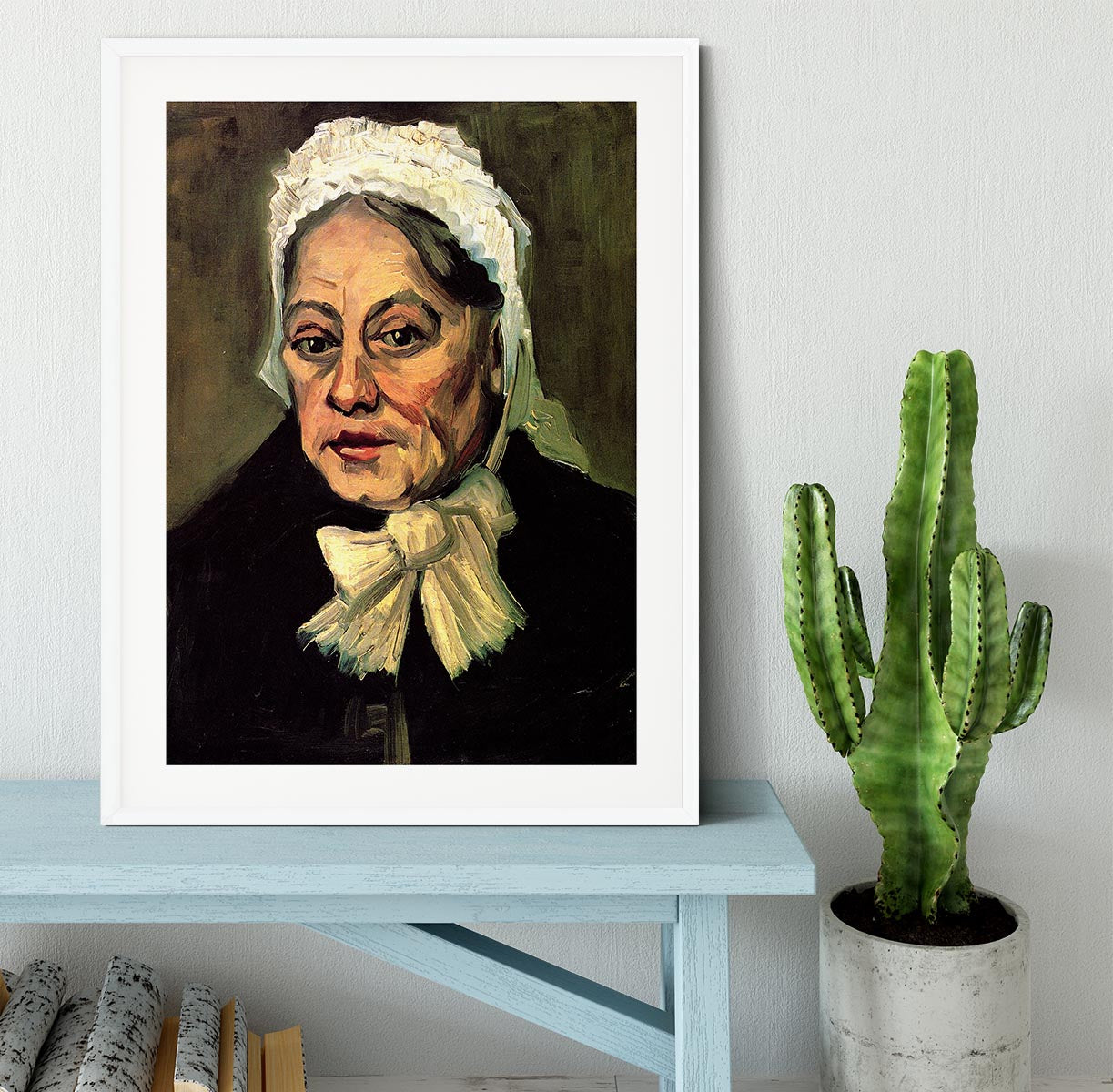 Framed artwork of Van Gogh's 'Head of an Old Woman with White Cap', showcasing intricate details and vibrant colors.