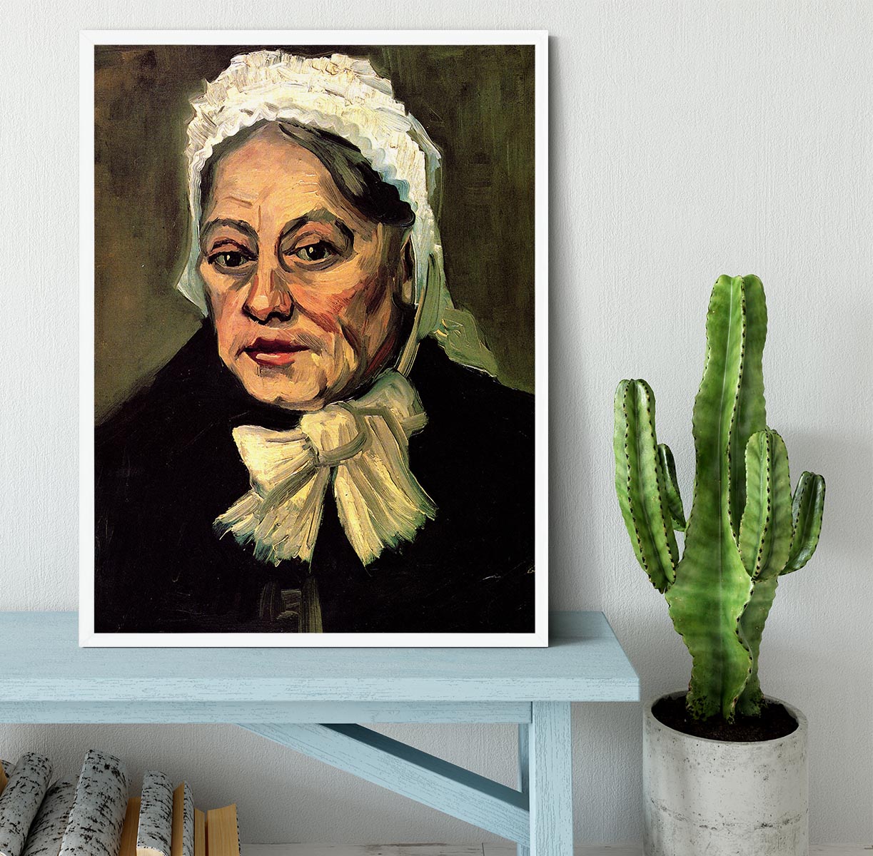 Framed artwork of Van Gogh's 'Head of an Old Woman with White Cap', showcasing intricate details and vibrant colors.