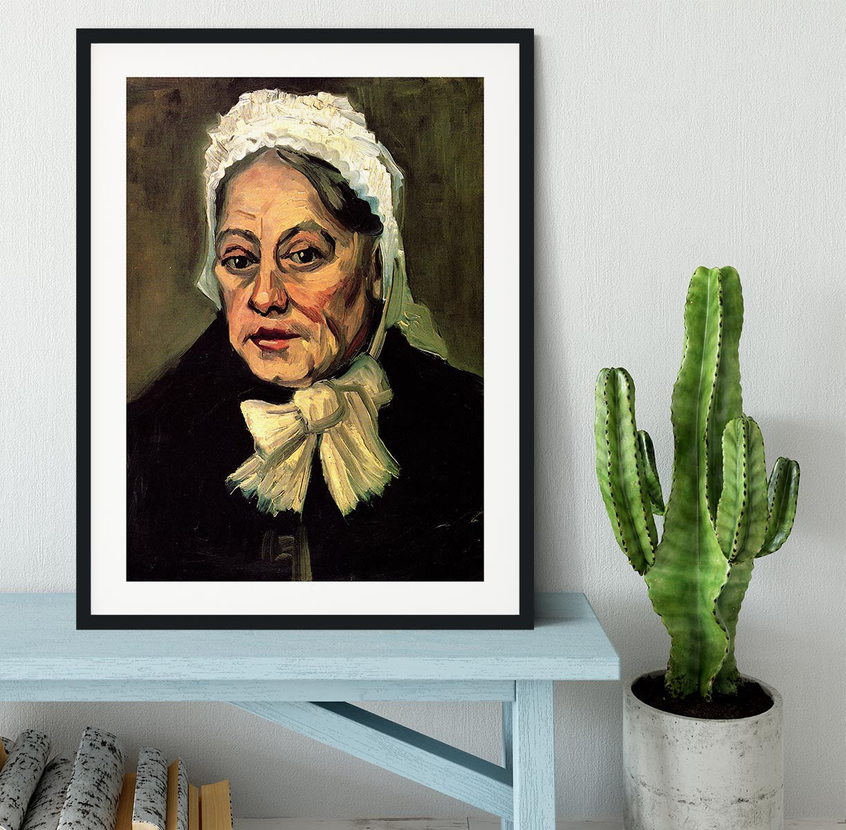 Framed artwork of Van Gogh's 'Head of an Old Woman with White Cap', showcasing intricate details and vibrant colors.
