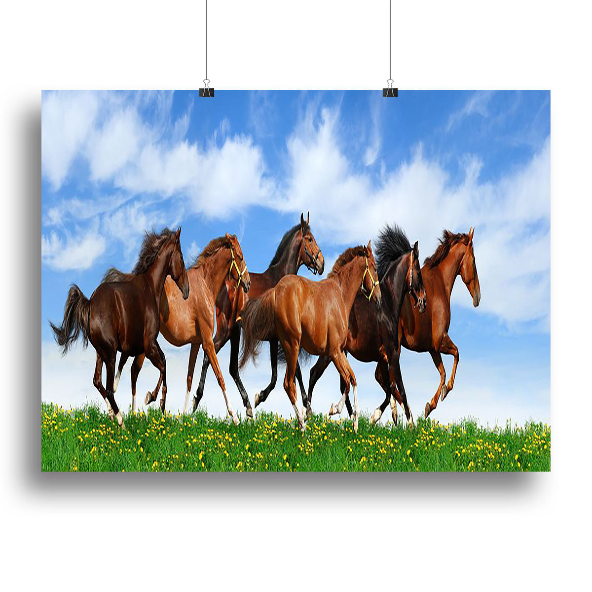 A vibrant canvas print depicting a herd of galloping horses in a lush green field, showcasing the beauty of nature.