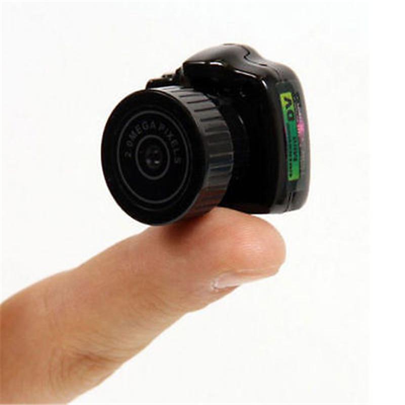 Hide Candid HD Mini Camera, compact design with USB cable and accessories.