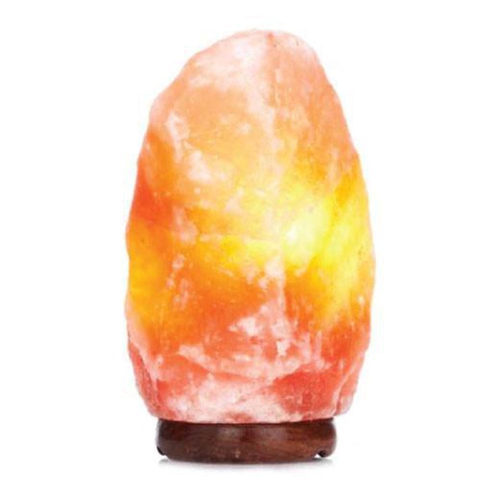 A beautifully shaped Himalayan Pink Salt Lamp emitting a warm glow, showcasing its natural rock texture and unique design.