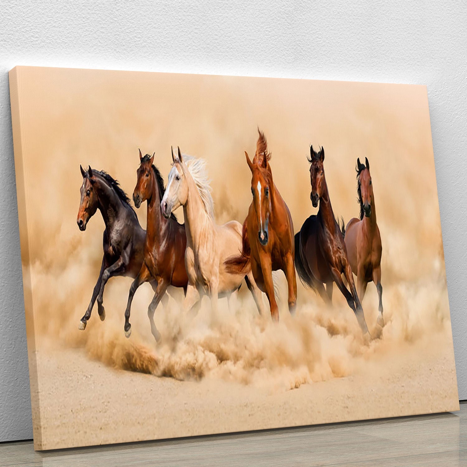 A breathtaking canvas print of a horse herd running through a desert during a sand storm, showcasing dynamic movement and natural beauty.