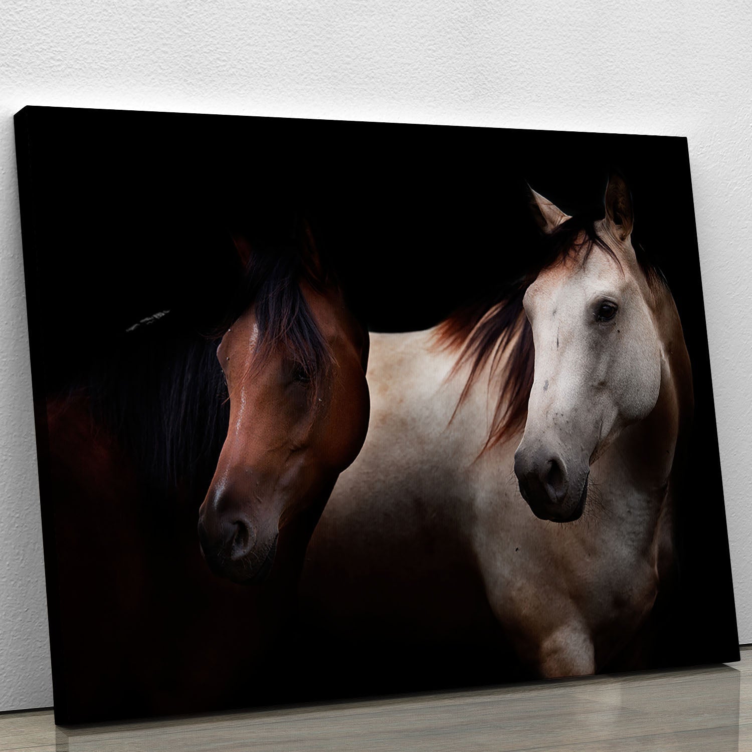 A beautiful canvas print featuring horses in a dark setting, showcasing their elegance and power.