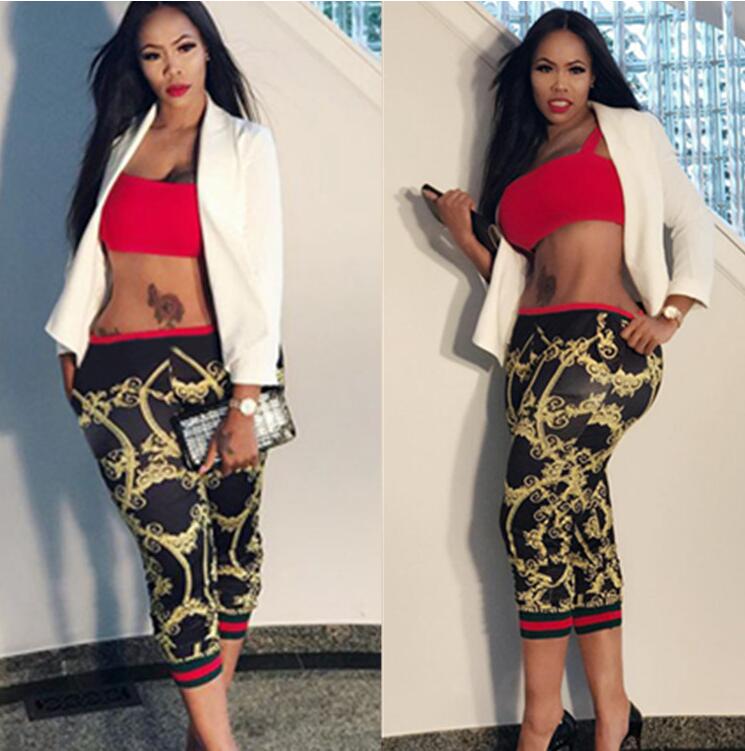 Stylish women's cropped leggings featuring a gold chain webbing print and stripe splicing design, perfect for a fashionable look.