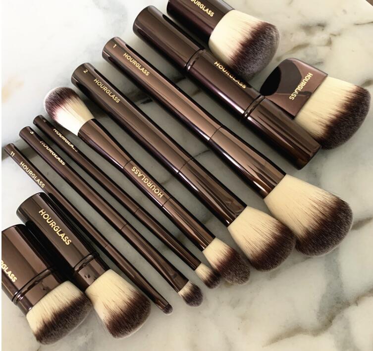 Hourglass Metal Series Loose Powder Blush Eye Shadow Brush with soft wool fiber bristles and a durable plastic handle, ideal for makeup application.