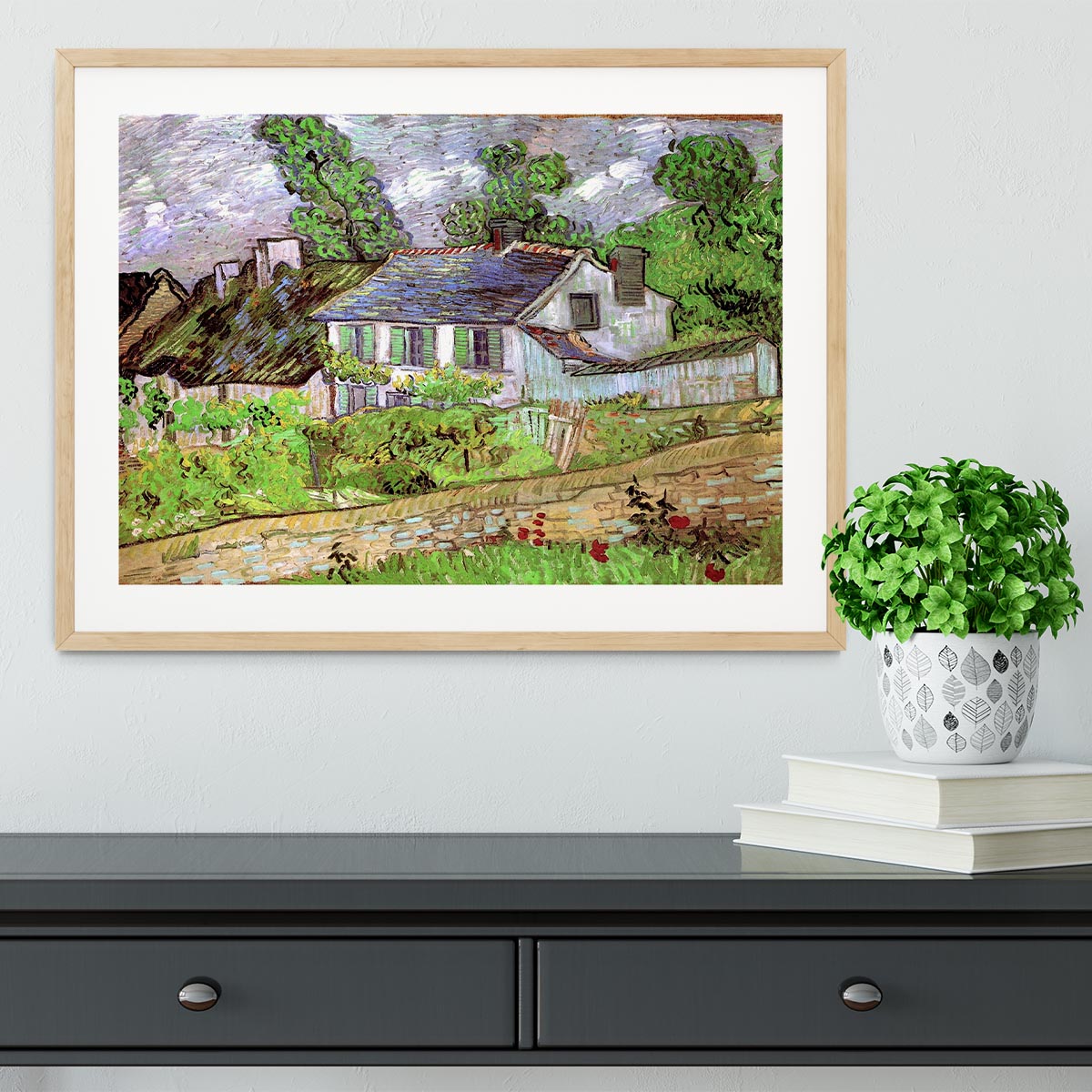 Framed print of Houses in Auvers 2 by Van Gogh, showcasing vibrant colors and intricate details in a stylish frame.