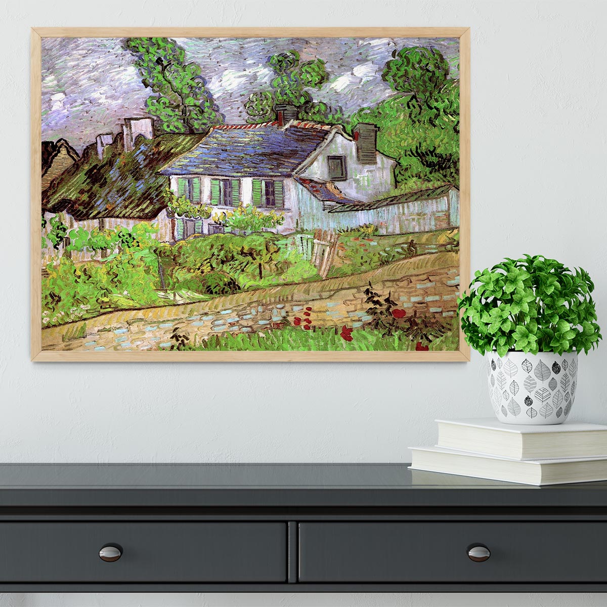 Framed print of Houses in Auvers 2 by Van Gogh, showcasing vibrant colors and intricate details in a stylish frame.