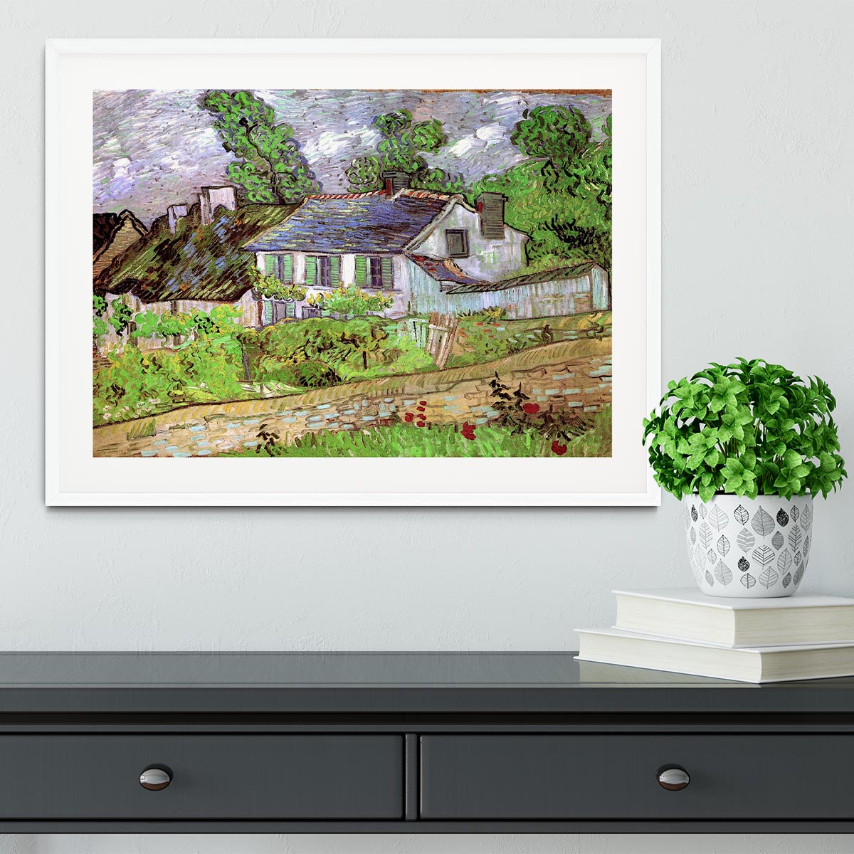 Framed print of Houses in Auvers 2 by Van Gogh, showcasing vibrant colors and intricate details in a stylish frame.
