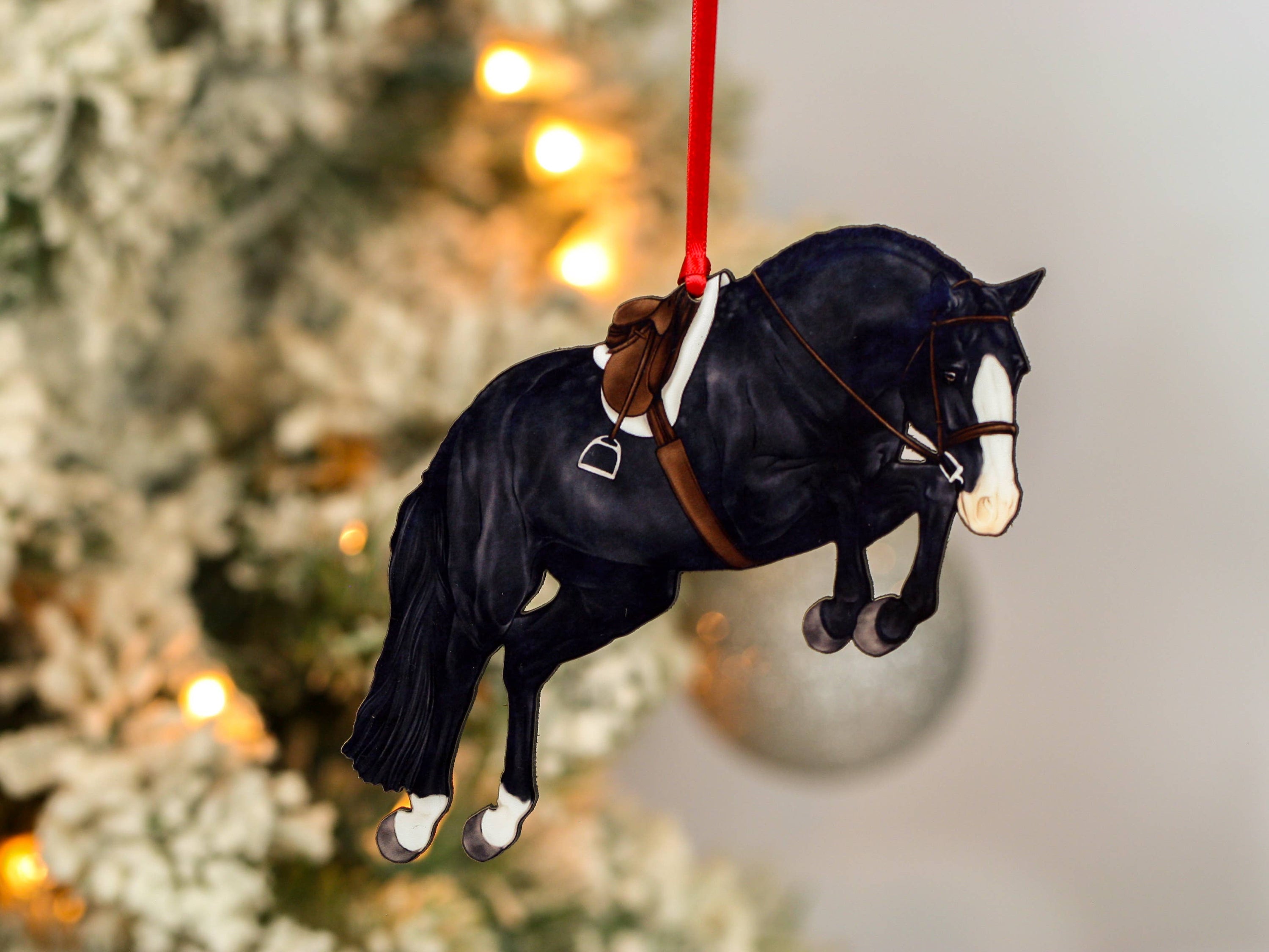 Hunter Jumper Horse Christmas Ornament featuring a black sport horse with red and black ribbons, handmade from composite wood.