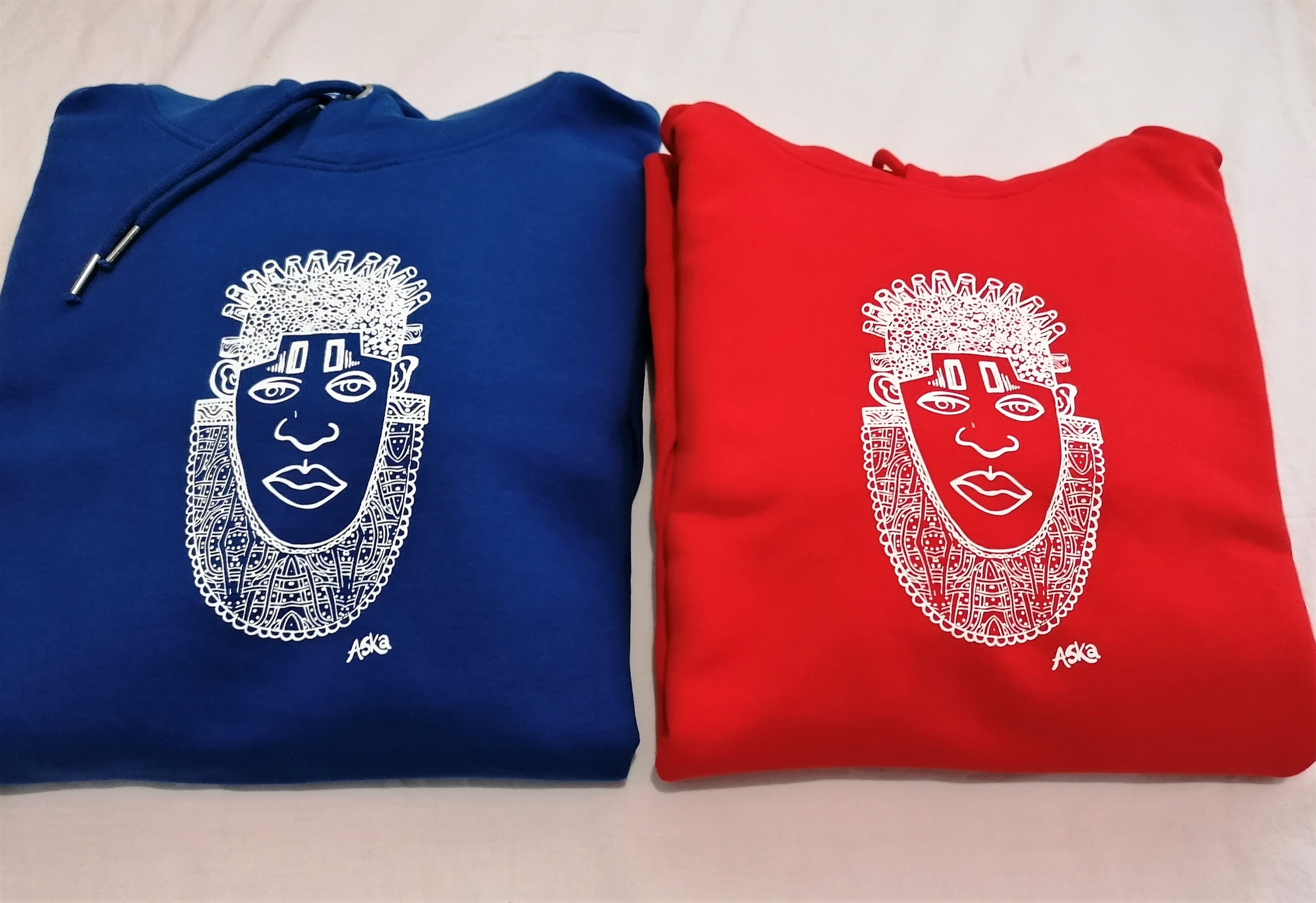 IDIA African Inspired Hoodie in vibrant red featuring white screen printed art of Queen IDIA, showcasing cultural heritage and contemporary fashion.