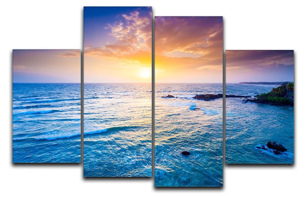 A beautiful 4-split canvas artwork depicting a sunset over the Indian Ocean, showcasing vibrant colors and serene ocean waves.