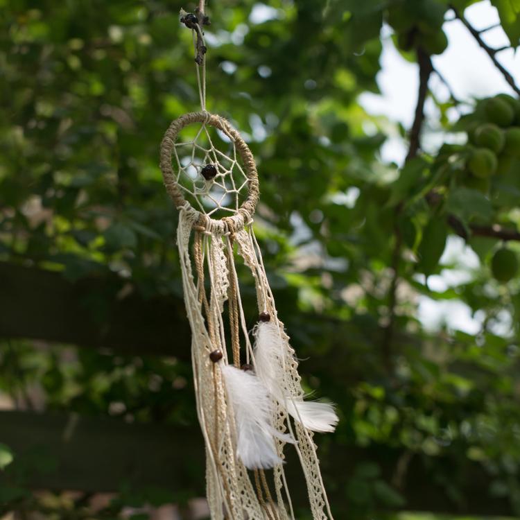 Handmade Indiana Dream Catcher Net featuring natural feathers, wood, and leather in various styles and colors.