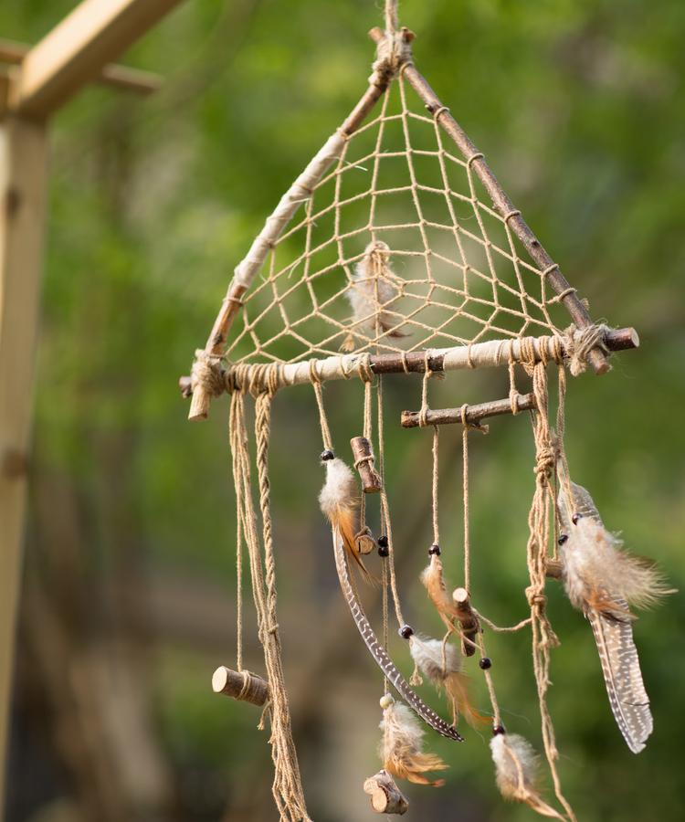 Handmade Indiana Dream Catcher Net featuring natural feathers, wood, and leather in various styles and colors.