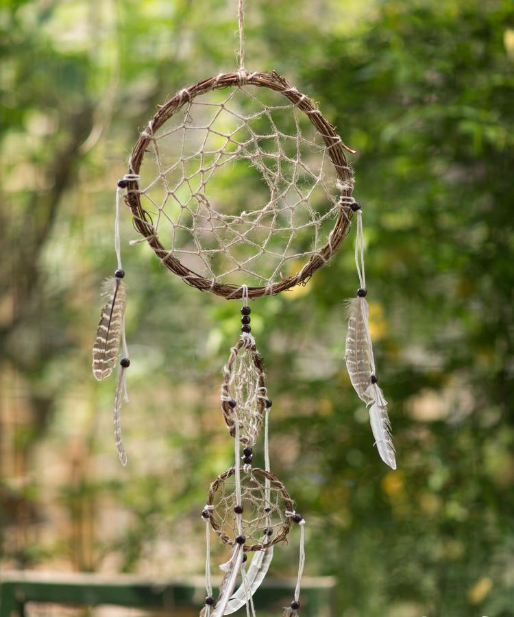Handmade Indiana Dream Catcher Net featuring natural feathers, wood, and leather in various styles and colors.