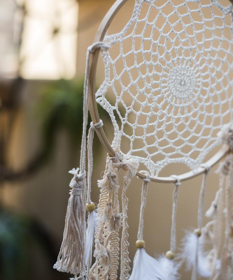 Handmade Indiana Dream Catcher Net featuring natural feathers, wood, and leather in various styles and colors.