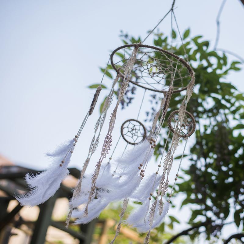 Handmade Indiana Dream Catcher Net featuring natural feathers, wood, and leather in various styles and colors.