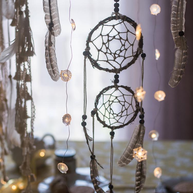 Handmade Indiana Dream Catcher Net featuring natural feathers, wood, and leather in various styles and colors.