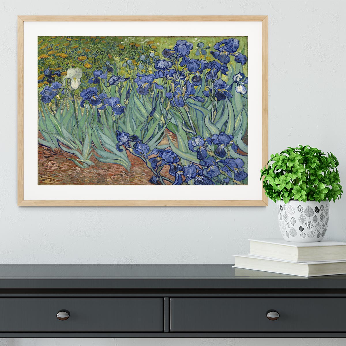 Framed print of Van Gogh's Irises artwork, showcasing vibrant colors and intricate details in a stylish frame.