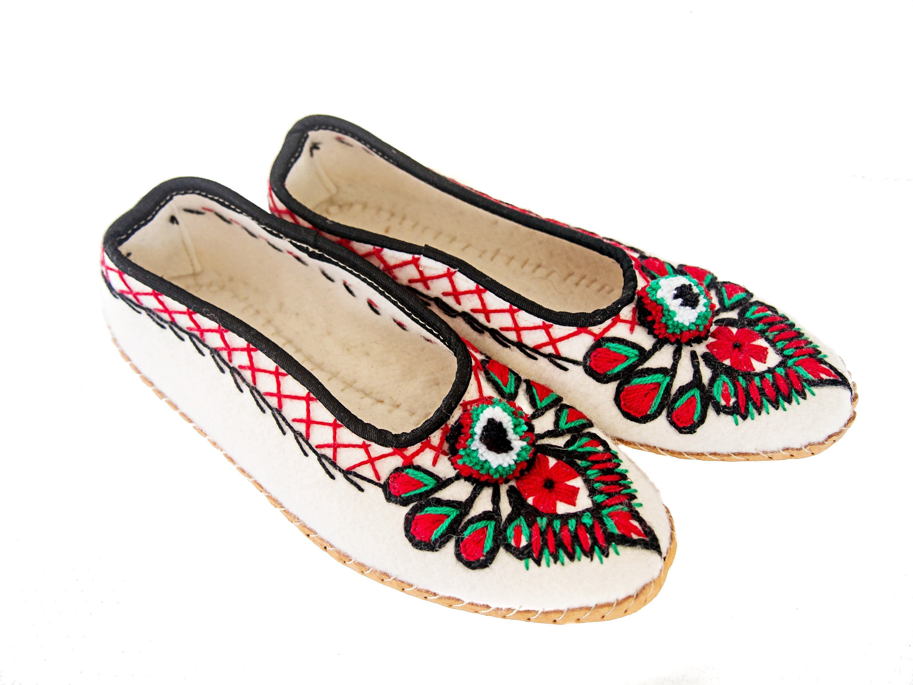 Ivory felt and real leather folk slippers, showcasing their elegant design and handmade craftsmanship.