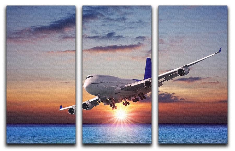 A stunning 3-panel canvas print depicting a jet liner flying over the sea at dusk, showcasing vibrant colors and serene imagery.