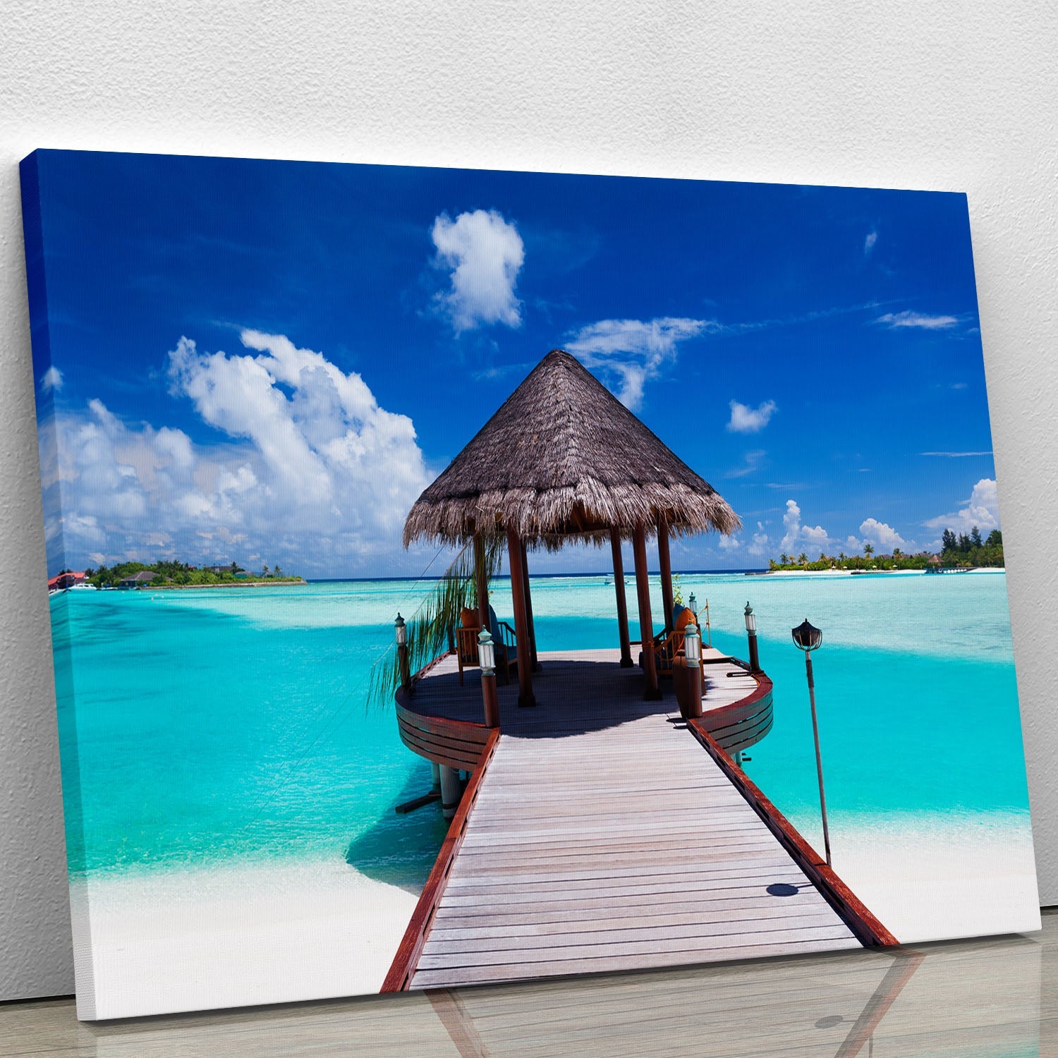 A beautiful canvas print of a jetty extending into a serene ocean, showcasing vibrant blues and greens, perfect for home decor.