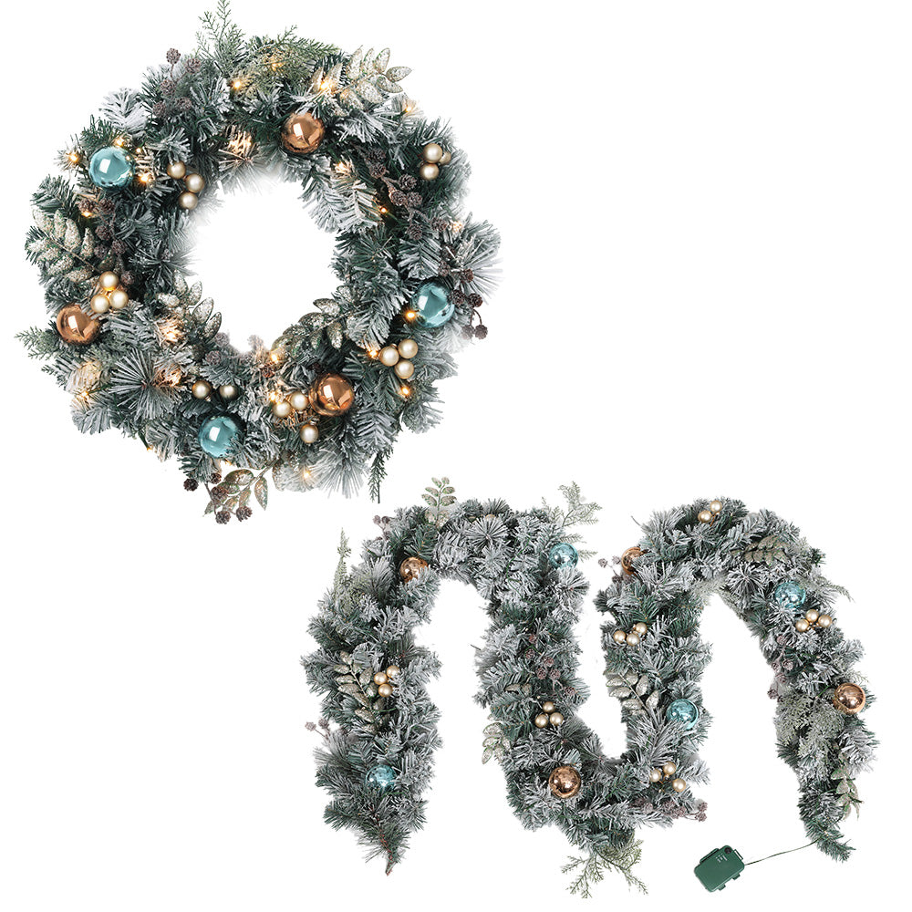 Jingle Jollys Christmas Garland and Wreath set featuring snow-frosted foliage, warm LED lights, and decorative pine cones.