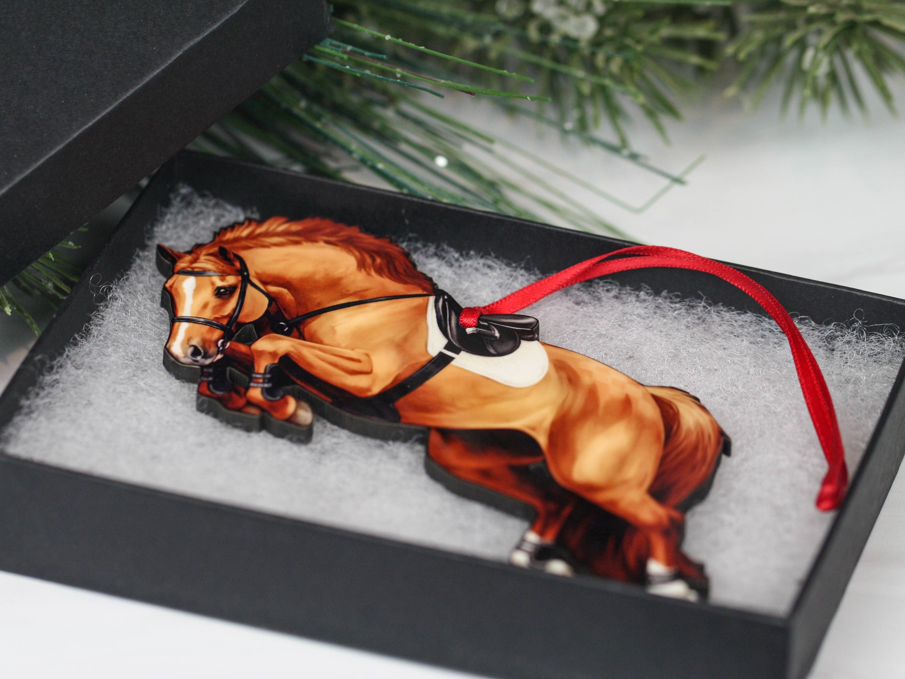 A beautifully crafted chestnut horse ornament, featuring a glossy finish and intricate laser-cut details, perfect for holiday decoration.