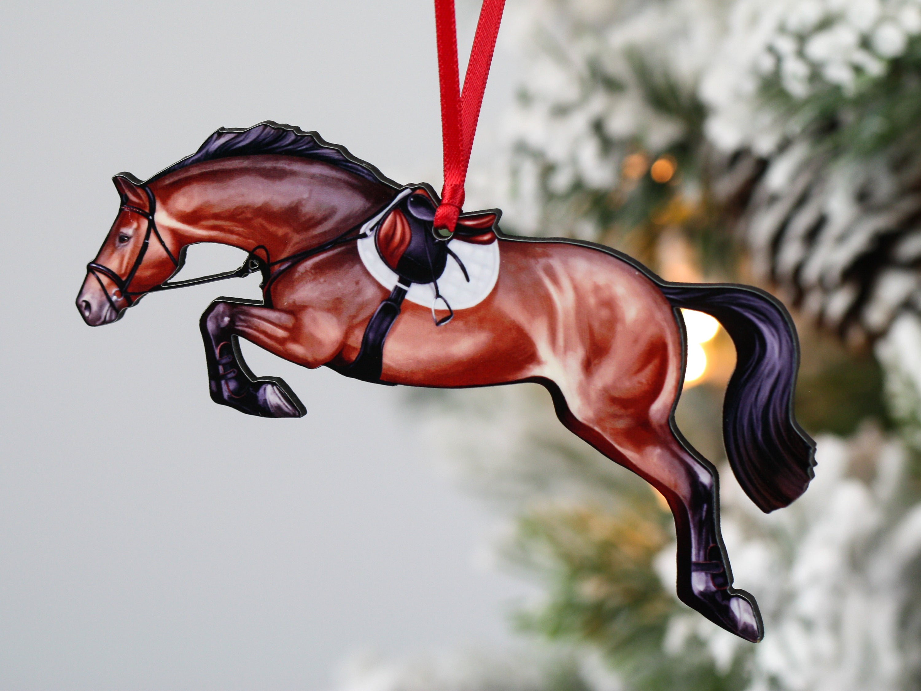 Handmade bay hunter jumper ornament, laser cut from composite wood, featuring a ribbon for hanging.