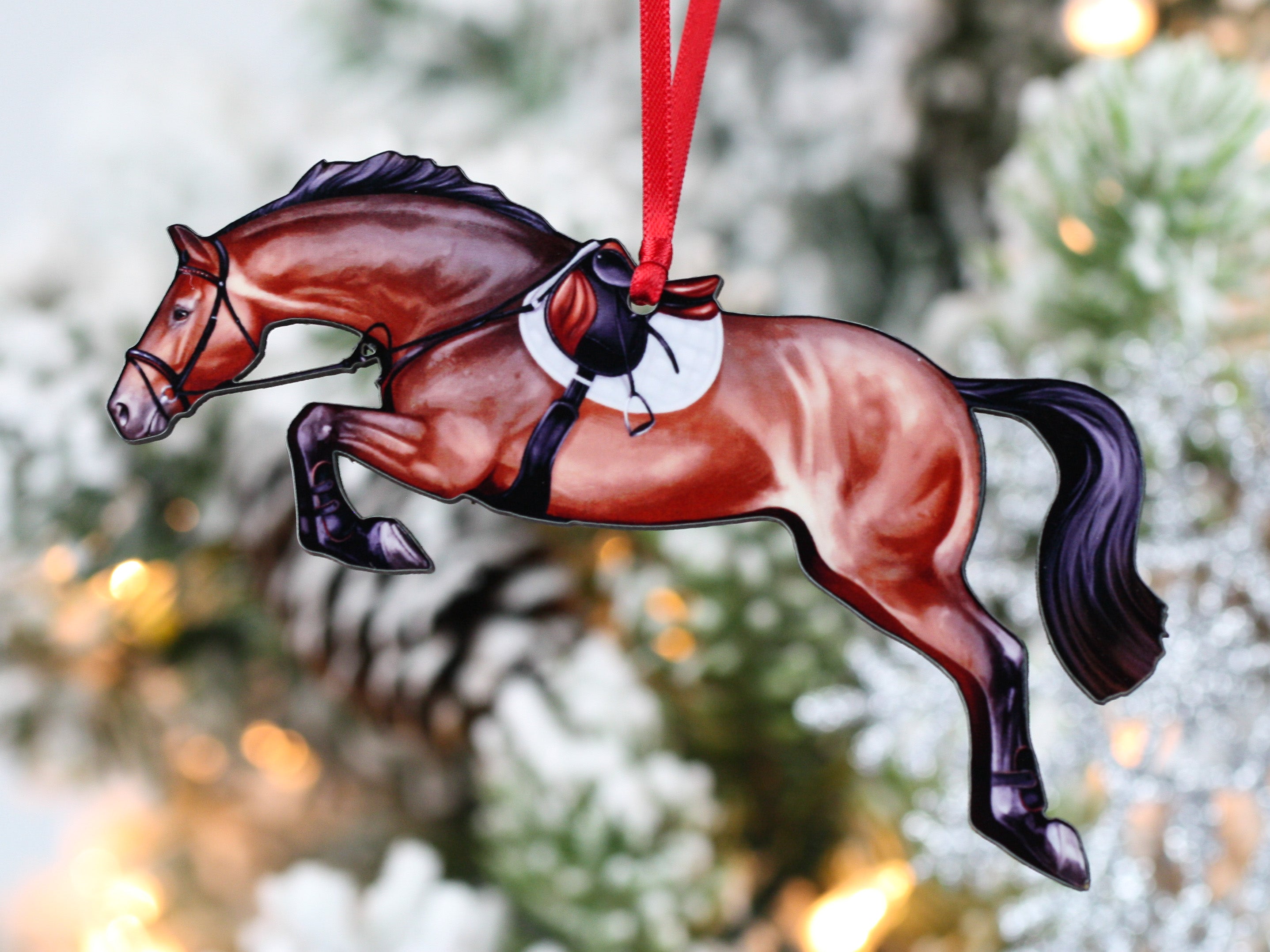 Handmade bay hunter jumper ornament, laser cut from composite wood, featuring a ribbon for hanging.