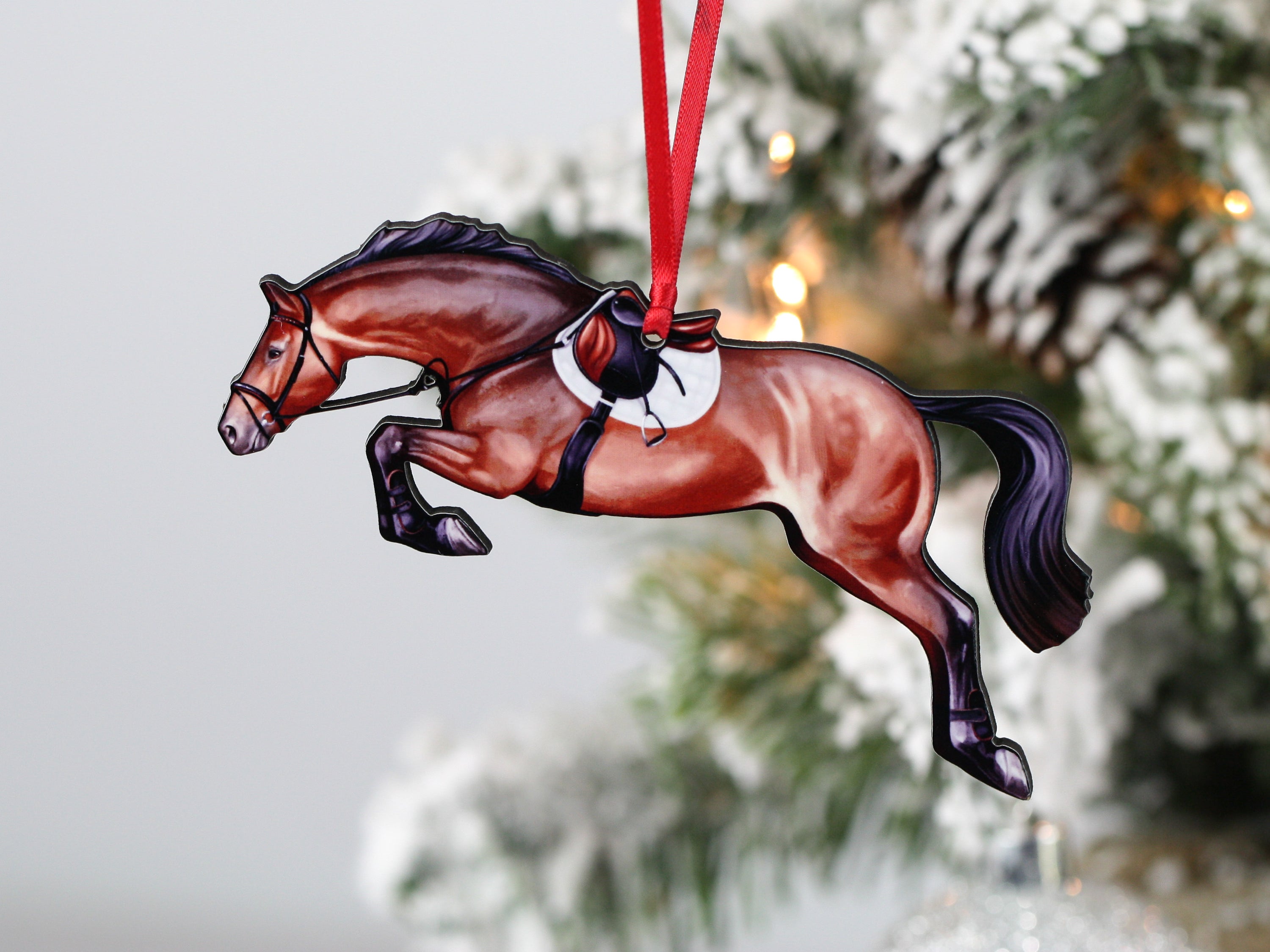 Handmade bay hunter jumper ornament, laser cut from composite wood, featuring a ribbon for hanging.