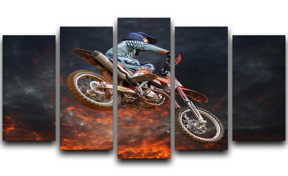 A dynamic 5-panel canvas artwork featuring a motocross rider in mid-jump, showcasing vibrant colors and action.