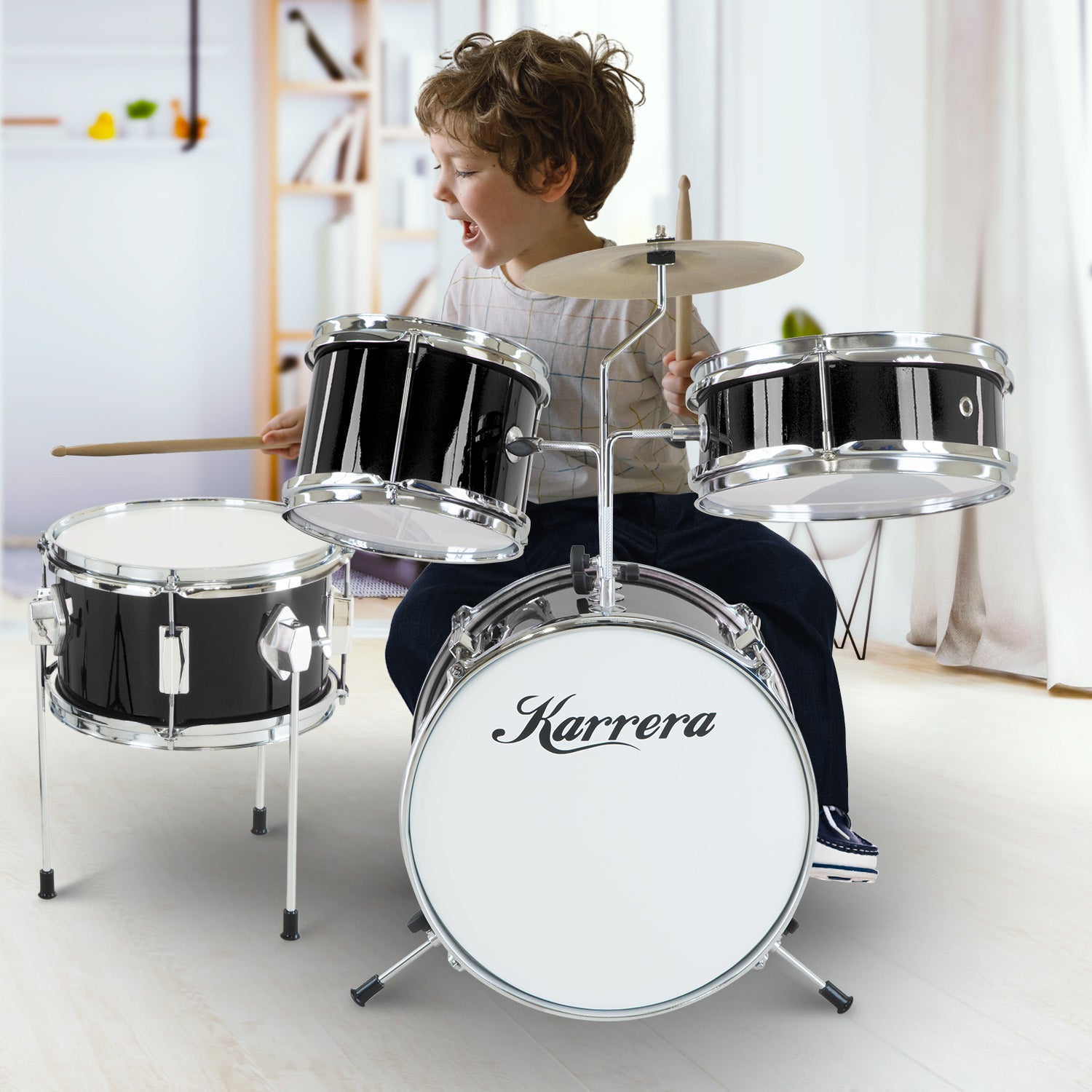 Karrera Children's 4-piece Drum Kit in black with metallic finish, including bass drum, toms, snare, cymbal, and drumsticks.