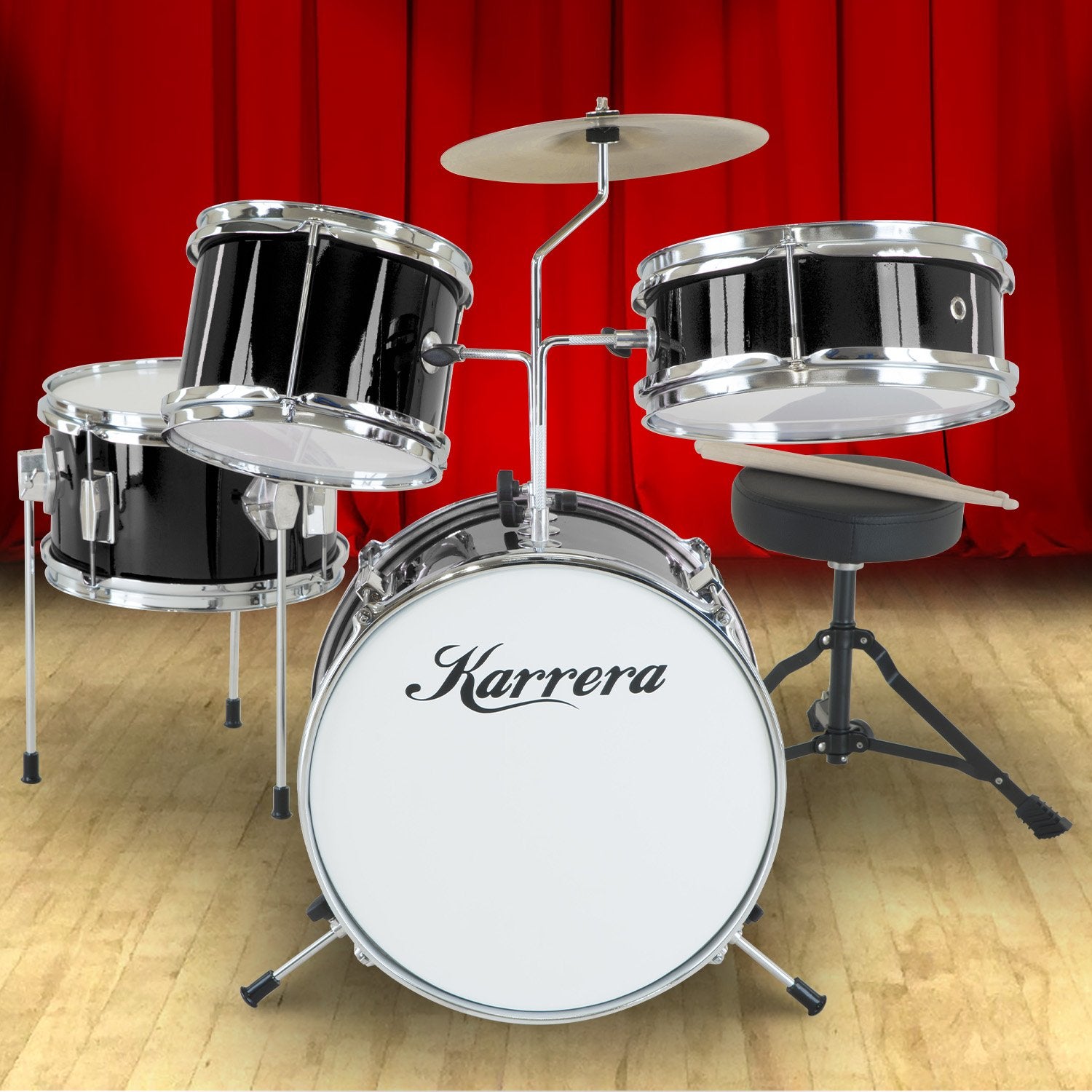 Karrera Children's 4-piece Drum Kit in black with metallic finish, including bass drum, toms, snare, cymbal, and drumsticks.
