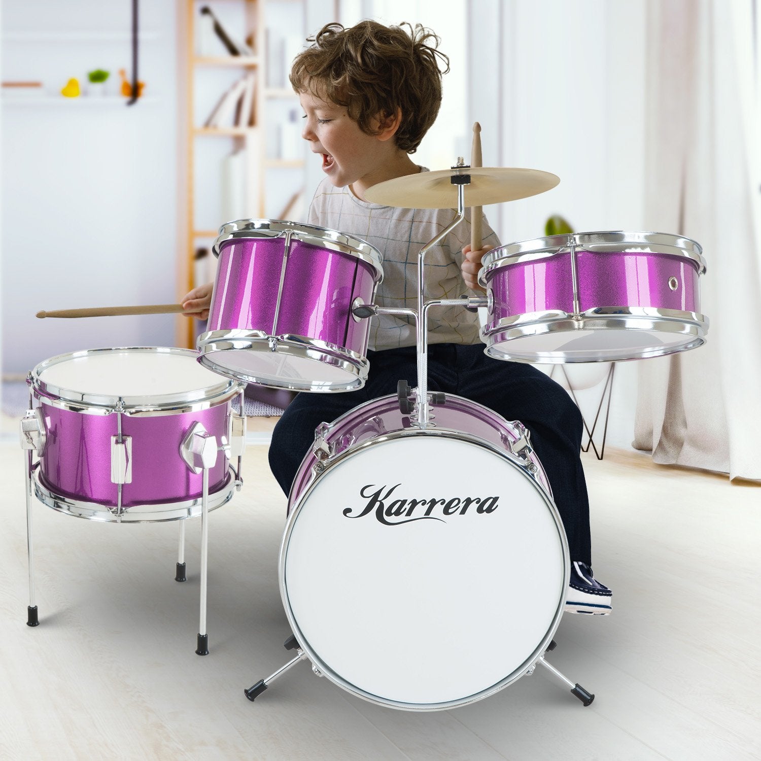 Karrera Children's 4pc Drum Kit in Purple with bass drum, toms, snare, cymbal, and drumsticks.