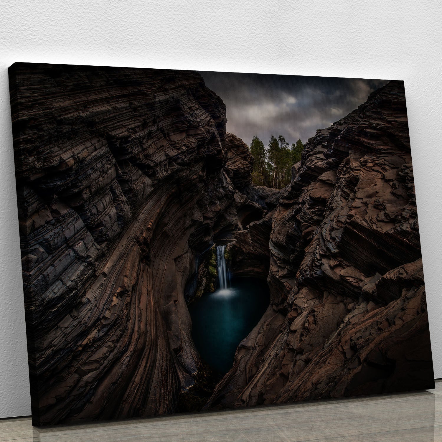 A beautiful canvas print of the Karijini National Park waterfall, showcasing vibrant colors and stunning natural scenery.