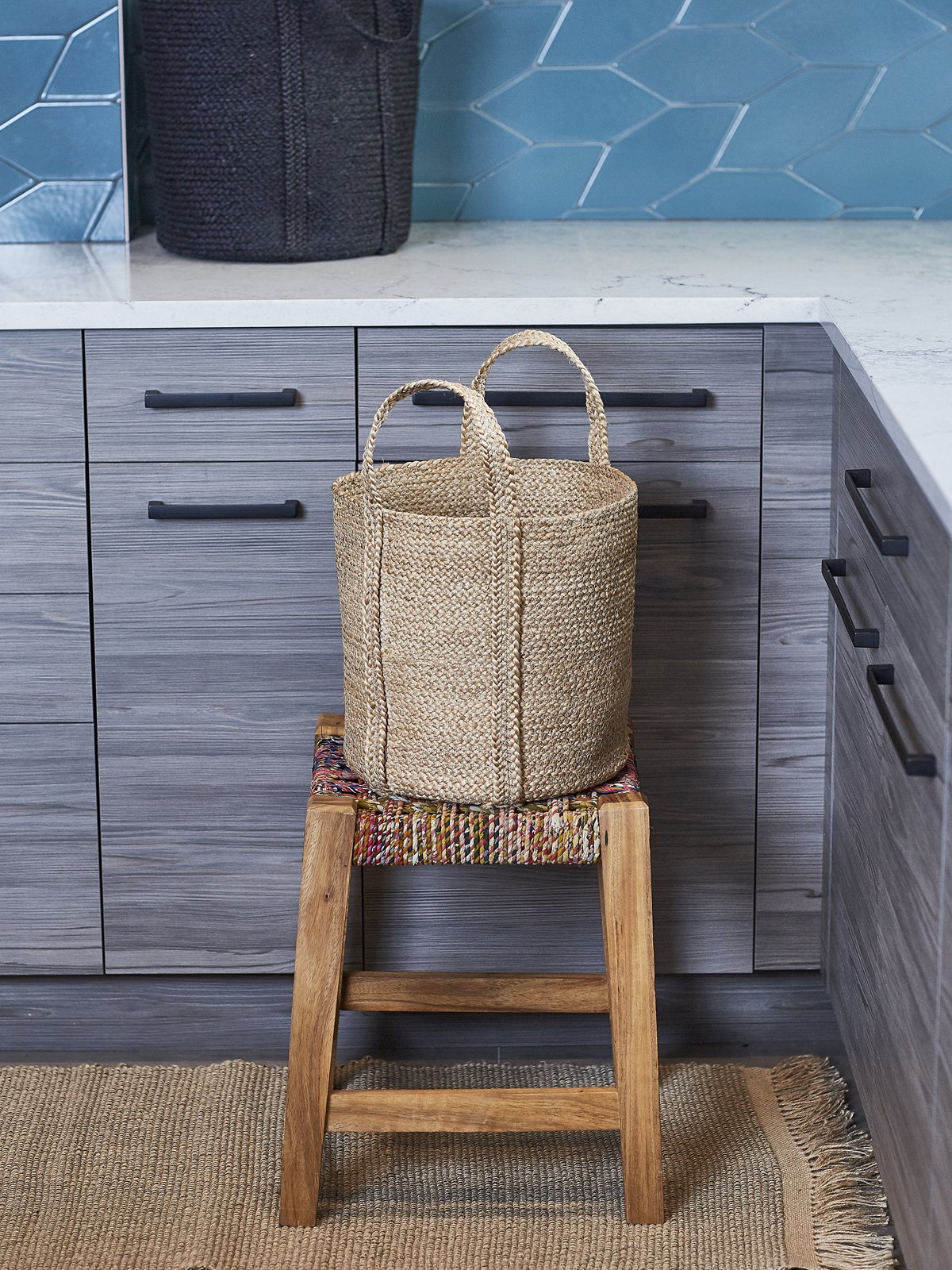 Natural Kata Basket with handle, handcrafted from braided jute, showcasing its unique texture and design.