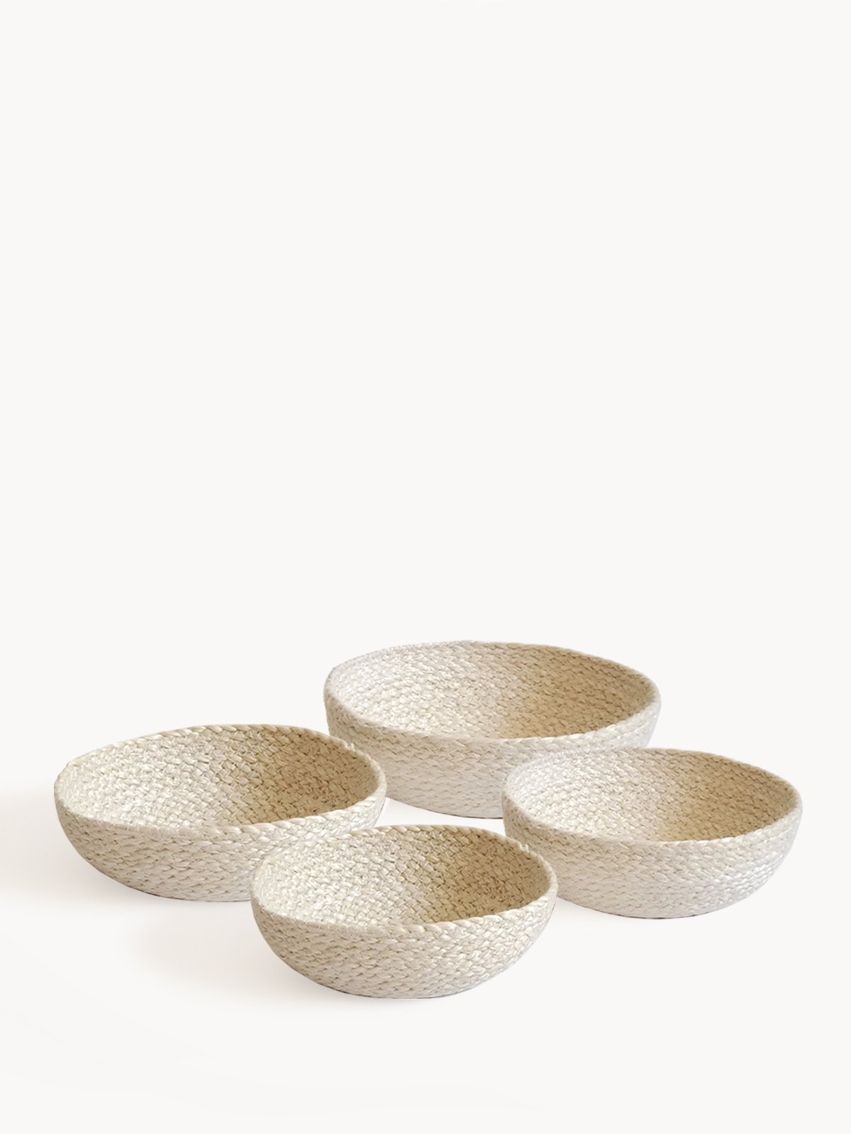 Set of four white Kata candy bowls made from natural jute, showcasing unique handcrafted designs.