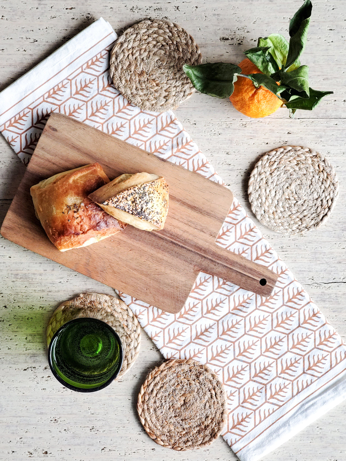 Set of 4 handmade jute drink coasters, round and natural color, perfect for protecting surfaces.