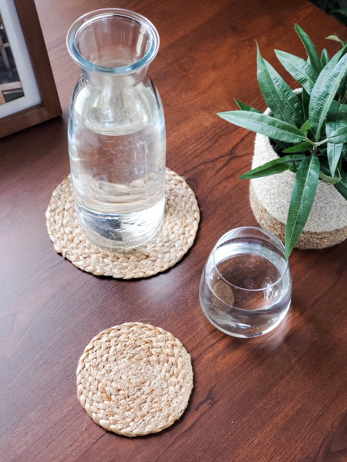 Set of 4 handmade jute drink coasters, round and natural color, perfect for protecting surfaces.