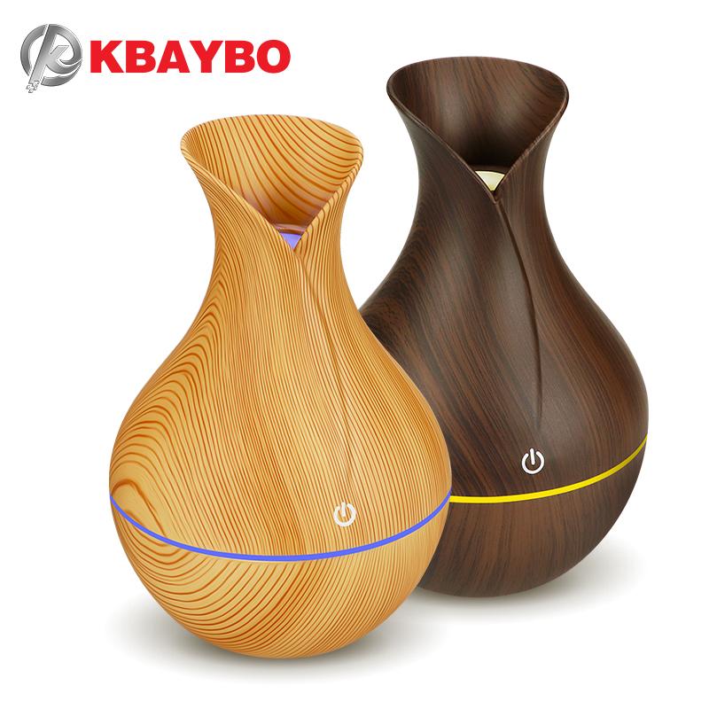 KBAYBO electric humidifier aroma oil diffuser in yellow wood design, emitting cool mist for a healthy atmosphere.
